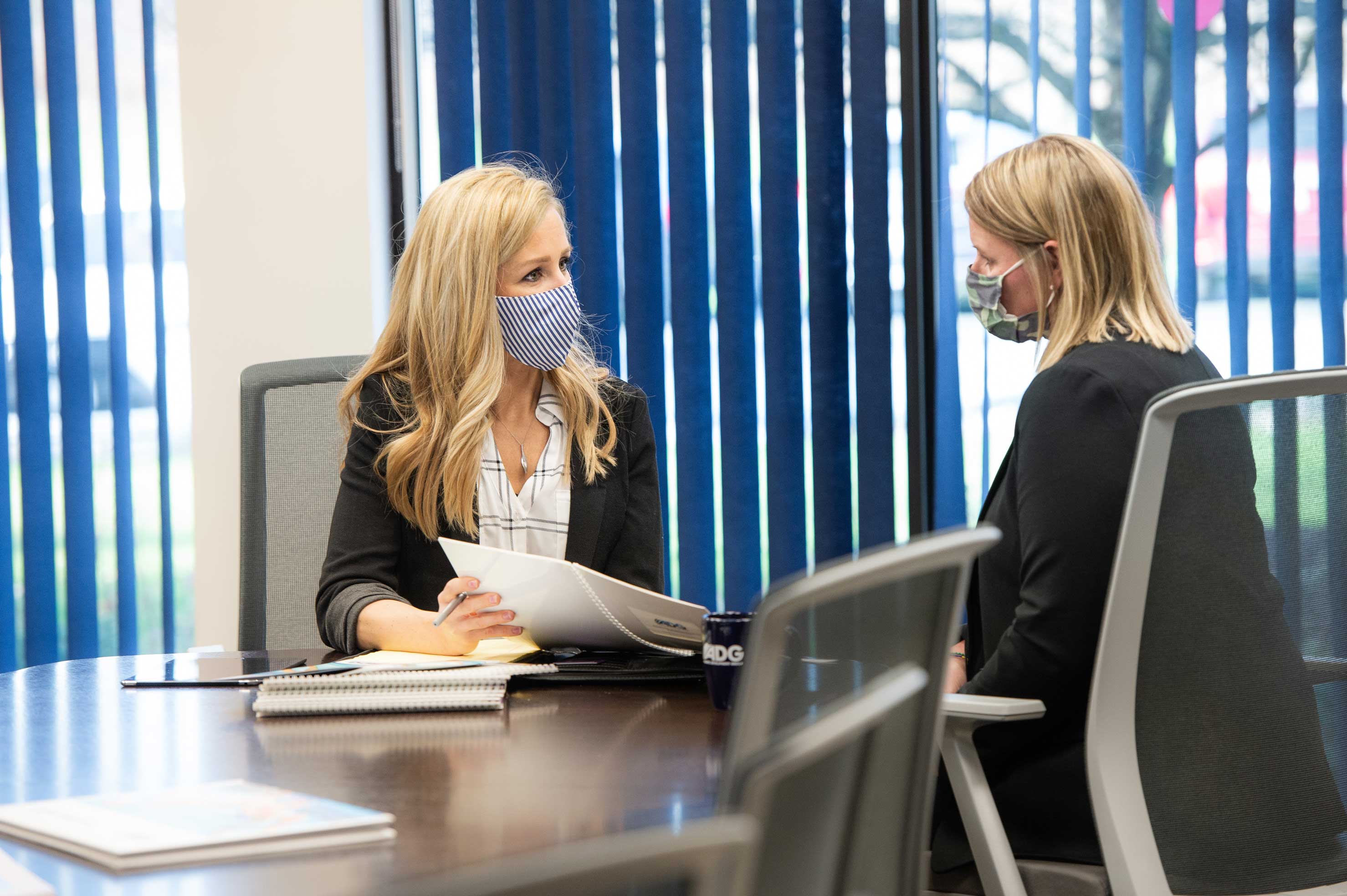 BST with client in conference room wearing masks